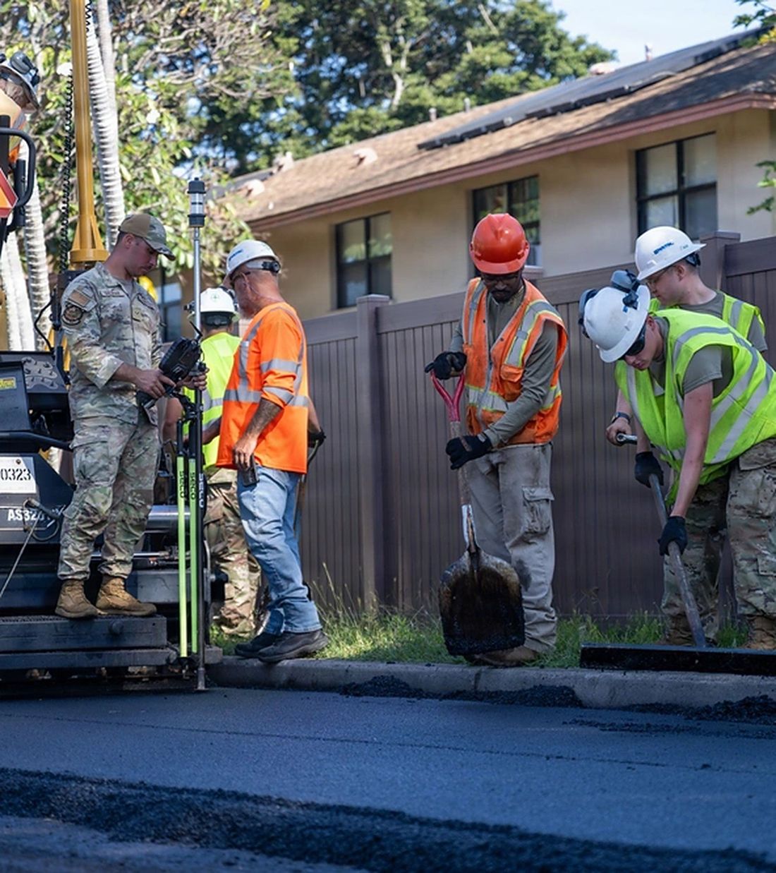 Crew paving on an active installation
